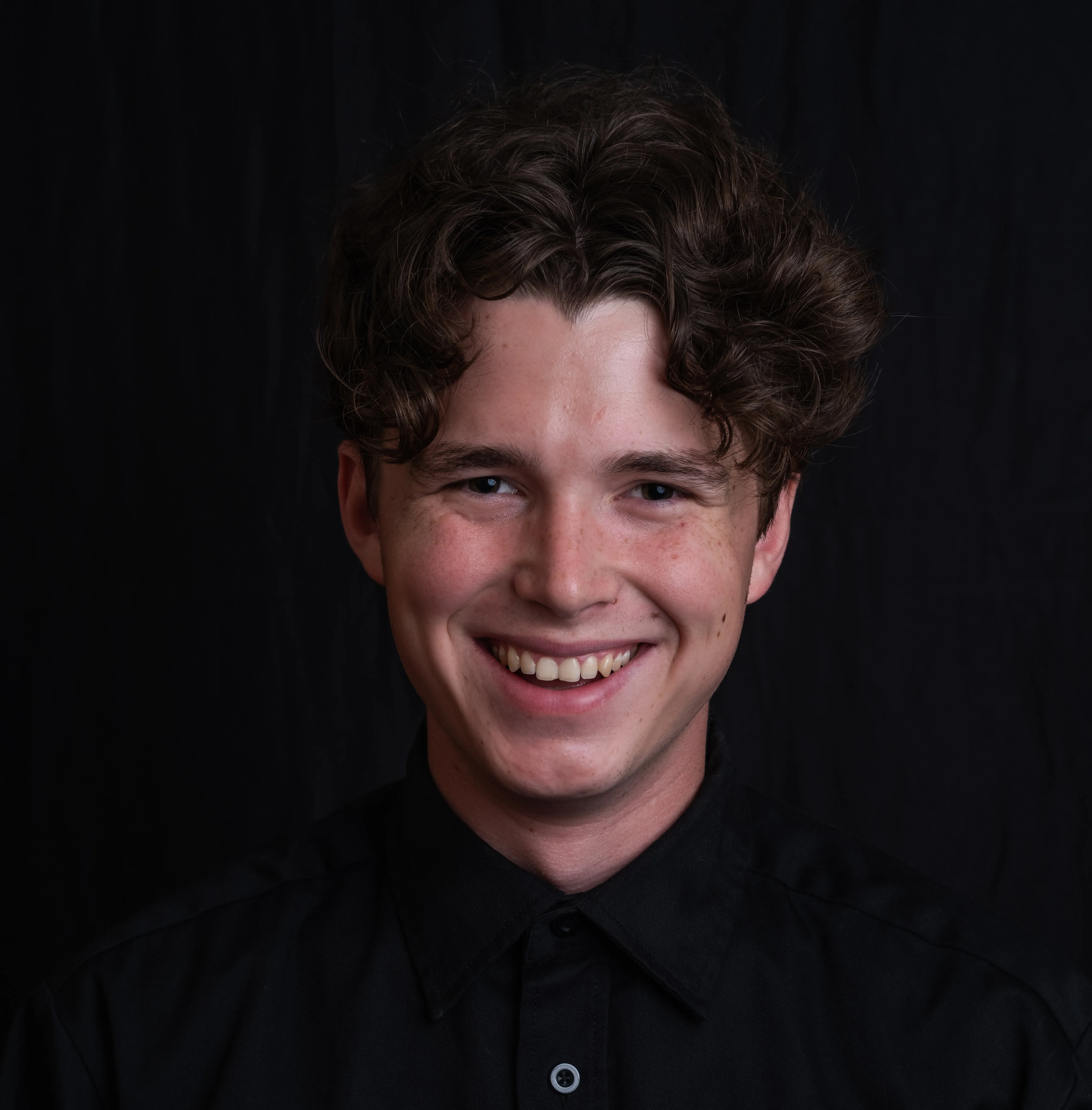 A professional headshot of Graham Davidge