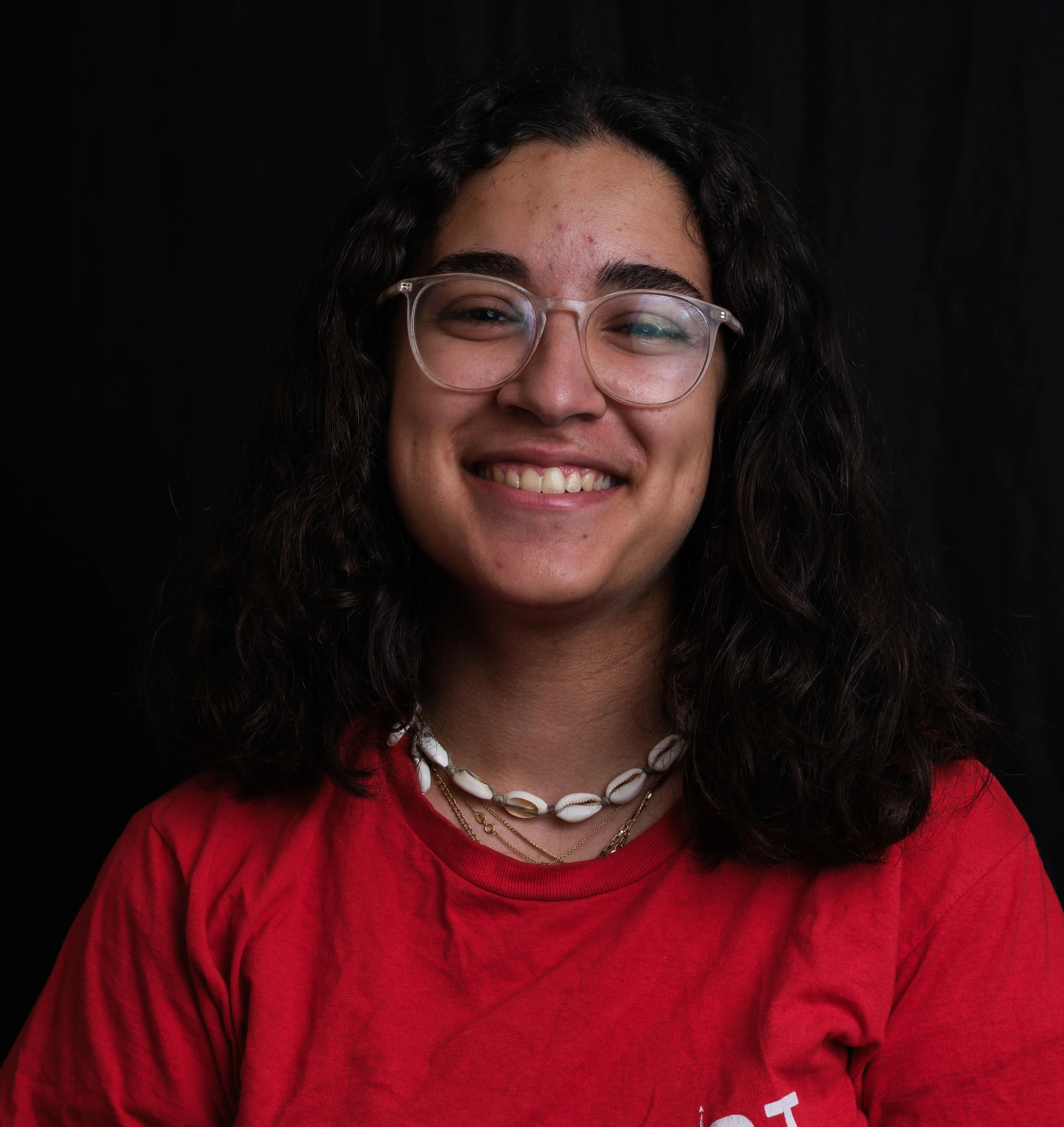 A professional headshot of Rawan Olabi