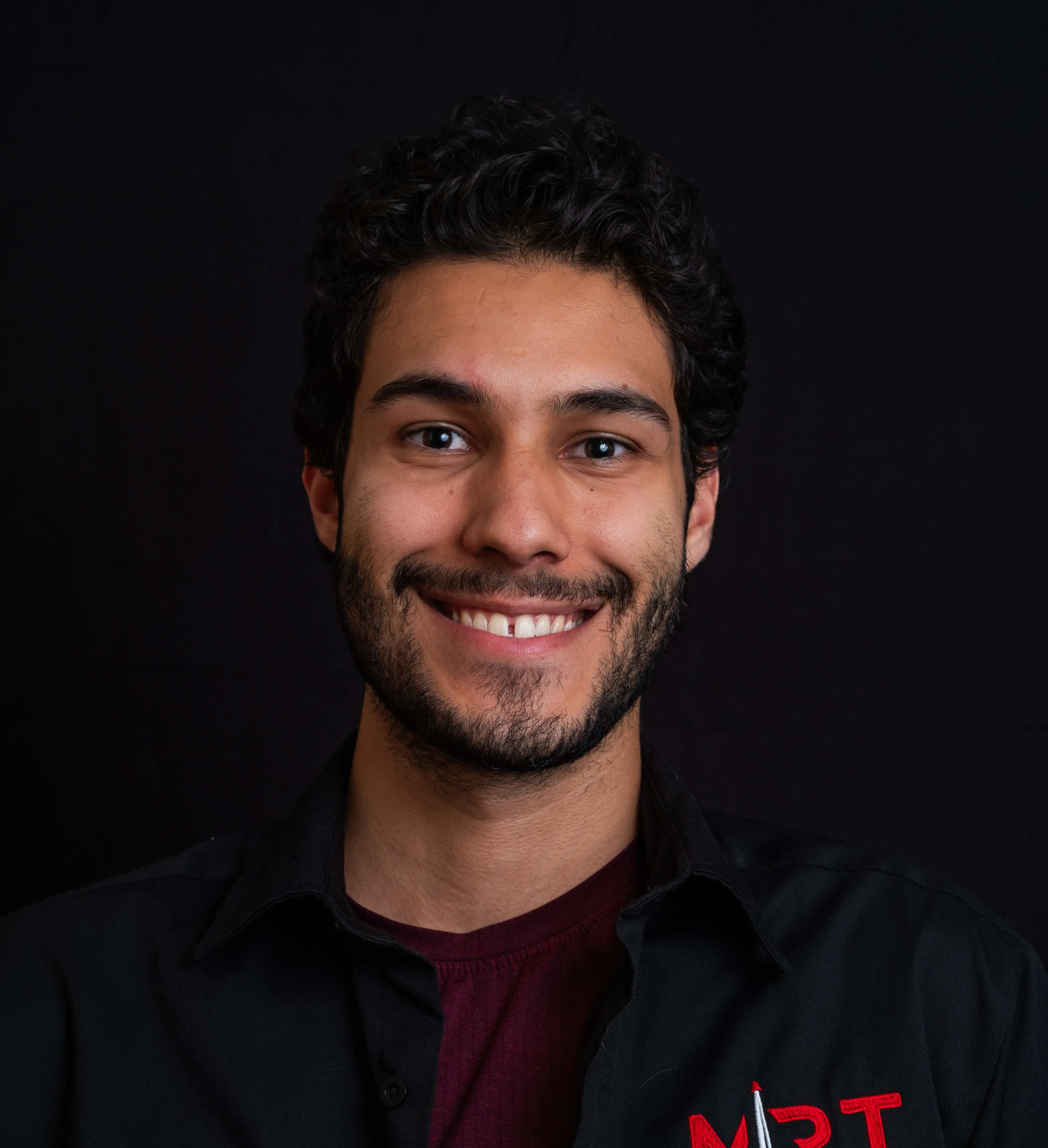 A professional headshot of Youssef Mustafa
